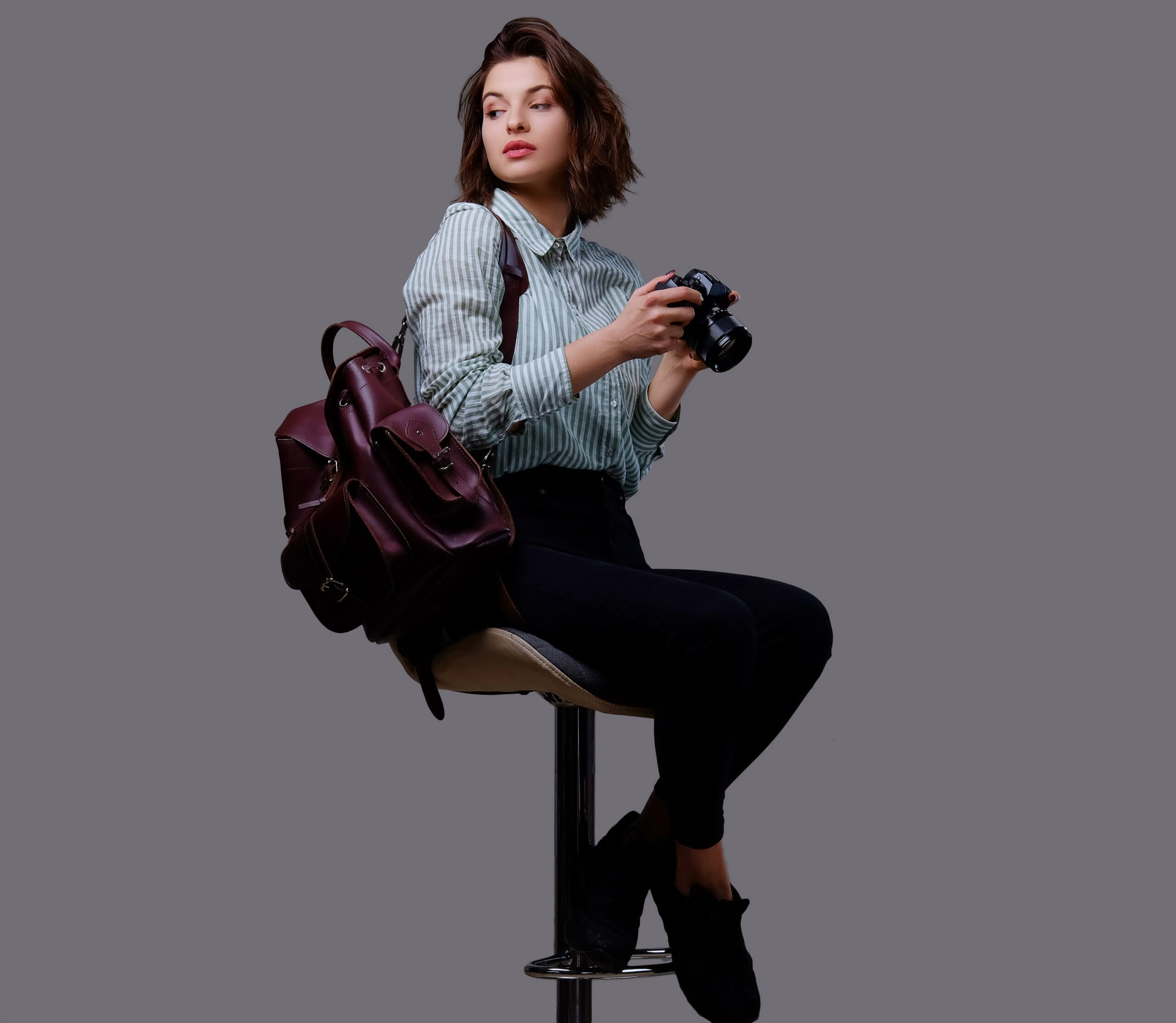 positive young female isolated grey background scaled